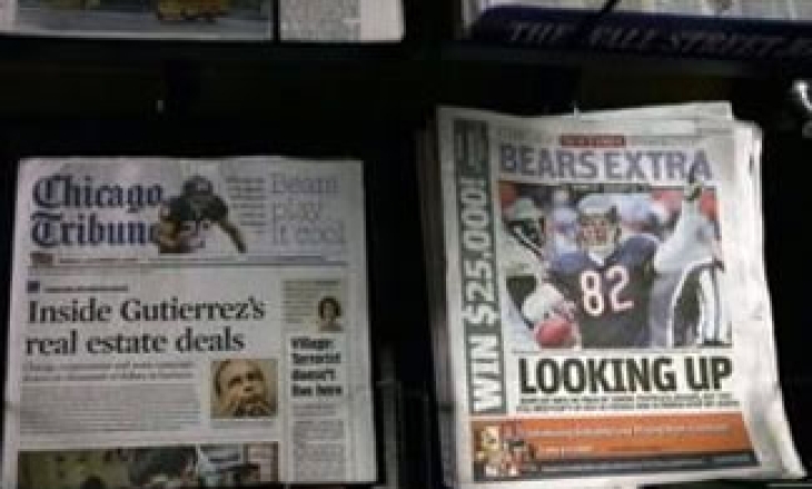 Acute ad crunch, $13 bn debt force newspaper giant Tribune Co to file for bankruptcy