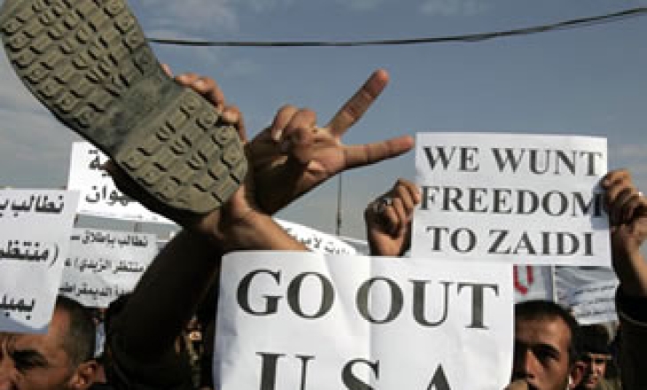 Iraqis take to the streets over arrest of journalist who threw shoes at US President Bush