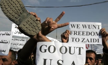 Iraqis take to the streets over arrest of journalist who threw shoes at US President Bush