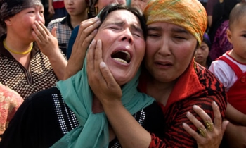 China sets prison terms for 3 Uighur Web managers